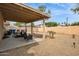 Spacious backyard featuring a covered patio and landscaping at 16729 N 157Th Ave, Surprise, AZ 85374