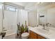 Standard bathroom featuring a shower over tub with a novelty shower curtain, toilet and vanity with sink at 16729 N 157Th Ave, Surprise, AZ 85374