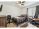 Bedroom with desk, chair, wardrobe and neutral decor at 16729 N 157Th Ave, Surprise, AZ 85374