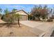 Exterior of property with an attached two-car garage and low-maintenance landscaping at 16729 N 157Th Ave, Surprise, AZ 85374