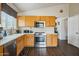 Well-maintained kitchen featuring light-colored wood cabinetry and stainless steel appliances at 16729 N 157Th Ave, Surprise, AZ 85374