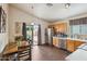 Eat-in kitchen with stainless appliances, wood table set, and a backyard view at 16729 N 157Th Ave, Surprise, AZ 85374