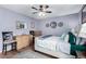 Comfortable bedroom with neutral colors, a ceiling fan, and a dresser with drawers at 16739 E El Lago Blvd # 202, Fountain Hills, AZ 85268