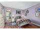The cozy bedroom is bright and airy with wood flooring and a large window at 16739 E El Lago Blvd # 202, Fountain Hills, AZ 85268