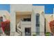 Condo exterior featuring a wrought iron fence and stairs leading to an upstairs unit with an outdoor seating area at 16739 E El Lago Blvd # 202, Fountain Hills, AZ 85268
