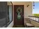 Charming front door decorated with a seasonal wreath and a 'Welcome Friends' sign, offering a warm welcome at 16739 E El Lago Blvd # 202, Fountain Hills, AZ 85268
