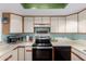 Well-lit kitchen showcasing modern appliances, ample counter space, and stylish white cabinetry at 16739 E El Lago Blvd # 202, Fountain Hills, AZ 85268