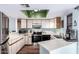 Efficient kitchen featuring white cabinets, stainless steel appliances, and a convenient breakfast bar at 16739 E El Lago Blvd # 202, Fountain Hills, AZ 85268