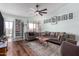 Cozy living room with hardwood floors and lots of natural light from the large sliding glass doors at 16739 E El Lago Blvd # 202, Fountain Hills, AZ 85268