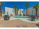 Inviting community pool area with mature landscaping, outdoor grilling, and comfortable seating for relaxation at 16739 E El Lago Blvd # 202, Fountain Hills, AZ 85268