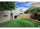 Private backyard boasts lush synthetic grass, perfect for year-round enjoyment and low maintenance at 17606 N 17Th Pl # 1115, Phoenix, AZ 85022