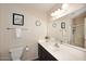Bathroom features a single sink vanity, neutral paint, and a mirror at 17606 N 17Th Pl # 1115, Phoenix, AZ 85022