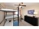 Bedroom features a bunk bed, carpet flooring, and a window at 17606 N 17Th Pl # 1115, Phoenix, AZ 85022
