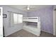 Bedroom features a bunk bed, carpet flooring, and a window at 17606 N 17Th Pl # 1115, Phoenix, AZ 85022