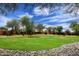Large common area showcasing mature trees and lush greenery, creating a serene and inviting atmosphere at 17606 N 17Th Pl # 1115, Phoenix, AZ 85022
