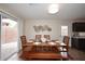 Bright dining area with a large wooden table, bench, and sliding glass door at 17606 N 17Th Pl # 1115, Phoenix, AZ 85022