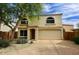 Charming two-story home with a two-car garage and desert landscaping at 17606 N 17Th Pl # 1115, Phoenix, AZ 85022