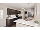 Functional kitchen with a stainless steel sink, ample counter space and updated appliances at 17606 N 17Th Pl # 1115, Phoenix, AZ 85022