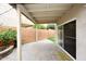 Relaxing covered patio with stone tile flooring, offers a seamless transition to the outdoors with a view of the lawn at 17606 N 17Th Pl # 1115, Phoenix, AZ 85022