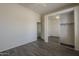 Neutral bedroom boasts tile floors and closet with mirrored doors, enhancing space and style at 17790 N 66Th Ln, Glendale, AZ 85308