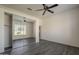 Bright bedroom featuring tile floors and a closet with mirrored doors that amplify the space at 17790 N 66Th Ln, Glendale, AZ 85308