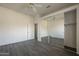 Neutral bedroom featuring large closet with mirrored doors and tiled flooring at 17790 N 66Th Ln, Glendale, AZ 85308