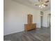 Bedroom with wood-look floors, ceiling fan, and dresser at 17790 N 66Th Ln, Glendale, AZ 85308