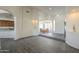 Open-concept living space with views to kitchen and dining, featuring wood-look flooring at 17790 N 66Th Ln, Glendale, AZ 85308
