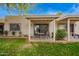 Cozy back patio features a table and chairs, perfect for enjoying outdoor living and relaxation at 18725 N 92Nd Dr, Peoria, AZ 85382