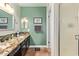 Bathroom with a stone tile counter, vanity and walk in shower at 18725 N 92Nd Dr, Peoria, AZ 85382