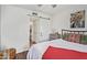 Bedroom with white walls, hardwood floors and a sliding barn door at 18725 N 92Nd Dr, Peoria, AZ 85382