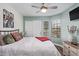 Bedroom with a window, closet, ceiling fan and hardwood floors at 18725 N 92Nd Dr, Peoria, AZ 85382