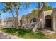Attractive home with a two-car garage, a well-maintained lawn, and mature trees at 18725 N 92Nd Dr, Peoria, AZ 85382