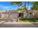 Charming single-story home featuring a well-maintained lawn and two-car garage at 18725 N 92Nd Dr, Peoria, AZ 85382