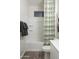 Bright bathroom with tub and shower combo at 19022 W Rose Ln, Waddell, AZ 85355