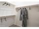 Spacious walk-in closet with rods and shelves at 19022 W Rose Ln, Waddell, AZ 85355