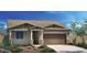 Charming single-story home featuring a two-car garage, well-maintained lawn and neutral color palette at 19022 W Rose Ln, Waddell, AZ 85355