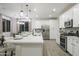 Spacious kitchen and dining area with modern appliances, center island, and open floor plan at 19022 W Rose Ln, Waddell, AZ 85355