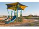 Neighborhood playground features a colorful shade cover, slide, and a wood chip ground covering at 19022 W Rose Ln, Waddell, AZ 85355
