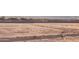Picture of a vacant lot, ready for construction with mountain view in the background at 19022 W Rose Ln, Waddell, AZ 85355