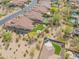 Property aerial view showcasing the tile roof, back yard, outdoor kitchen, landscaping, and desert views at 1904 N Steele --, Mesa, AZ 85207