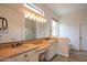 Bright bathroom with double sinks, granite countertops, and a walk-in shower at 1904 N Steele --, Mesa, AZ 85207