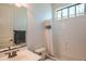 Hall bathroom with a single vanity and a tub and shower combo with gray and white shower curtain at 1904 N Steele --, Mesa, AZ 85207