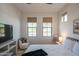 Bedroom showcasing two large windows, a sitting area, and neutral decor at 1904 N Steele --, Mesa, AZ 85207
