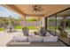 Enjoy outdoor living on this covered patio, complete with comfortable seating and views of the landscaped backyard at 1904 N Steele --, Mesa, AZ 85207