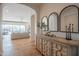 Bright foyer featuring wood floors, arched doorways, and stylish decorative accents at 1904 N Steele --, Mesa, AZ 85207