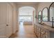 Elegant home entryway featuring wood floors, white trim, and stylish decorative accents at 1904 N Steele --, Mesa, AZ 85207