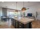 Bright, open-concept kitchen featuring a large island with pendant lighting and stainless steel appliances at 1904 N Steele --, Mesa, AZ 85207