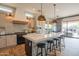 Well-appointed kitchen with a large island, black appliances, and ample counter space at 1904 N Steele --, Mesa, AZ 85207