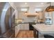 Spacious kitchen with stainless steel appliances, light cabinetry, and designer touches at 1904 N Steele --, Mesa, AZ 85207
